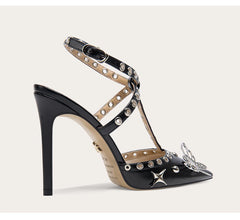 A front view of a high-heel sandal, highlighting the thin heel and buckle strap.