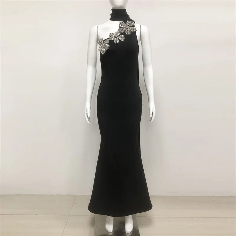 High neck formal black dress featuring bold floral shoulder detail