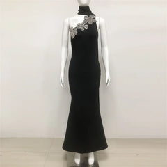High neck formal black dress featuring bold floral shoulder detail