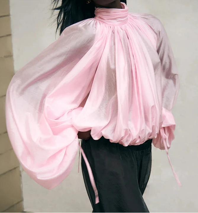 Loose fit sheer top with gathered volume through the sleeves