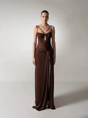 A full-length shot of a high-split sheath gown, highlighting its elegant silhouette.