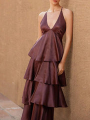 Back view of burgundy tiered maxi gown with side lace-up detail