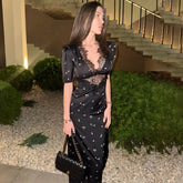 Black hollow lace patchwork midi dress styled for elegant evening parties