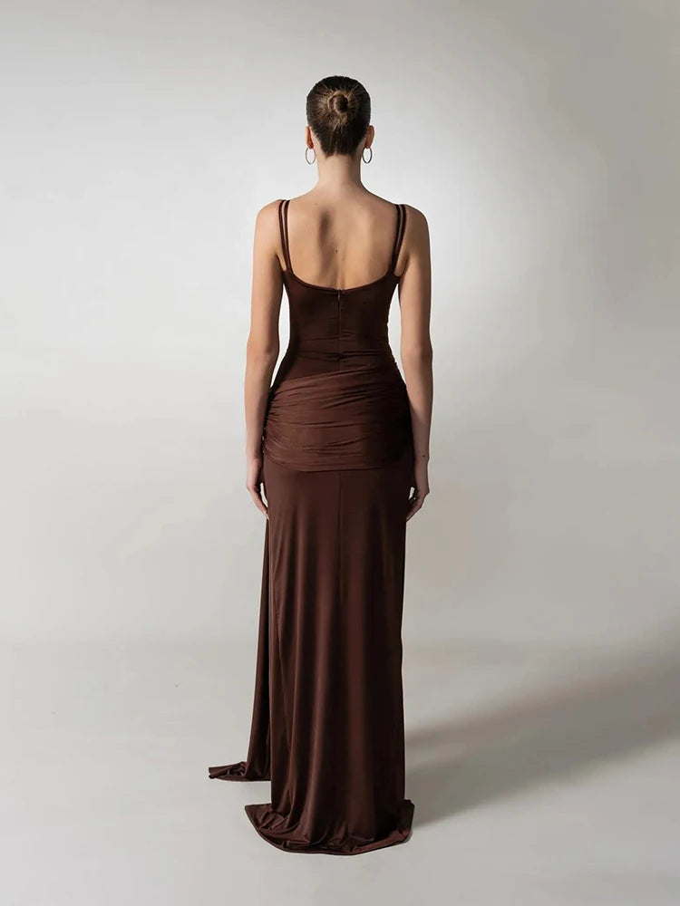 A close-up of the hollow-out detail on the brown party gown.