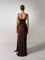 A close-up of the hollow-out detail on the brown party gown.