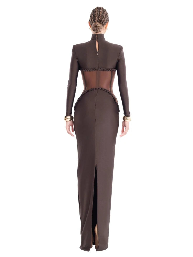 A full-length shot of a hollow-out slim dress, highlighting its elegant silhouette.