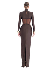A full-length shot of a hollow-out slim dress, highlighting its elegant silhouette.