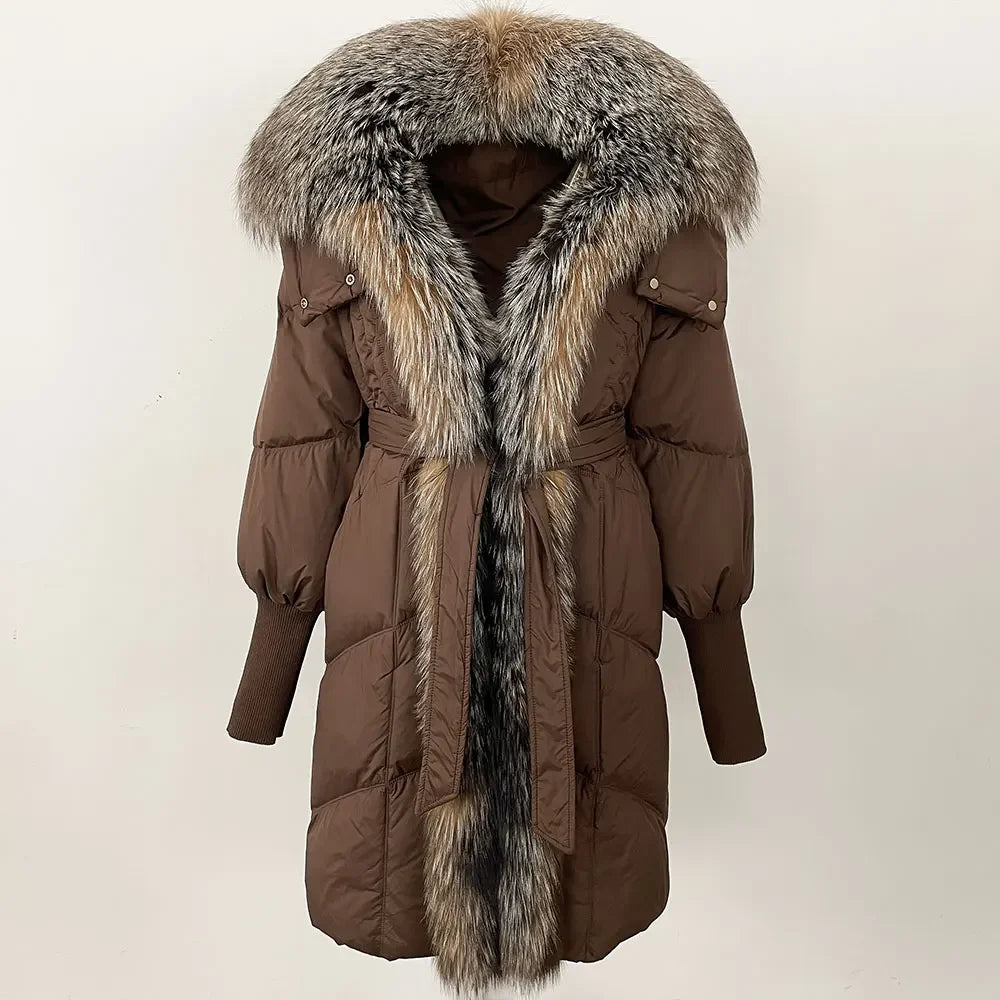 Longline puffer coat displayed front-facing, highlighting the fur-trimmed hood and structured winter silhouette