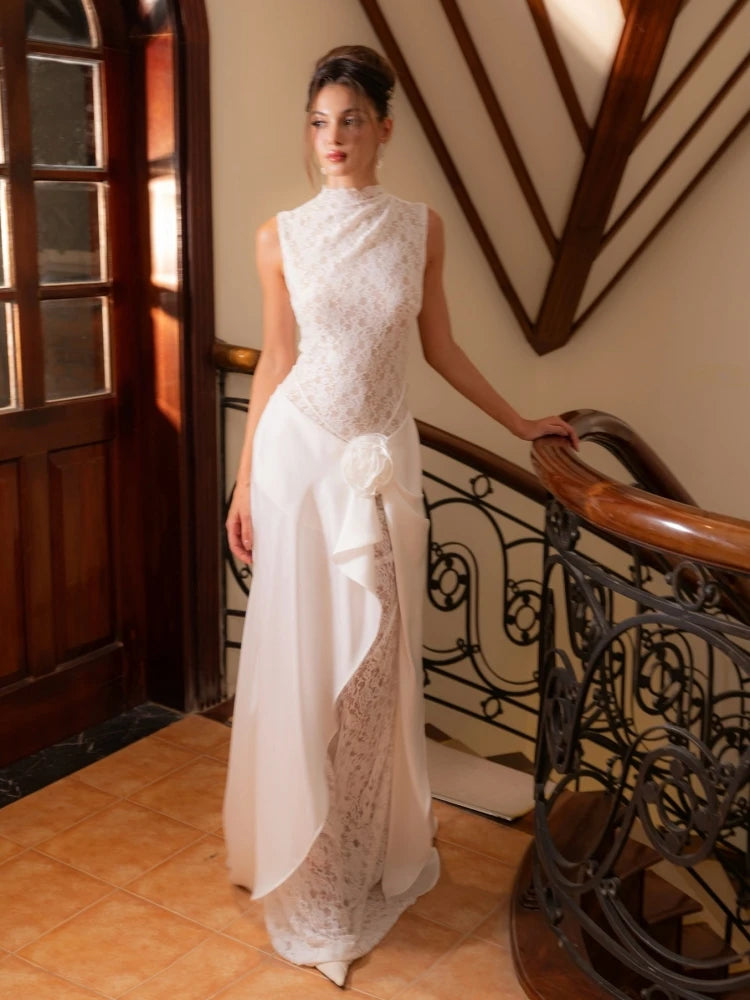 Close-up of the round neckline and lace bodice, highlighting the delicate texture and clean sleeveless cut across the shoulders.