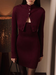 Evening outfit styling of a ribbed cami mini dress with cropped cardigan and pointed heels for modern city wear.