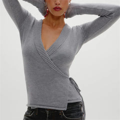 Soft wrap knit sweater styled in a relaxed silhouette
