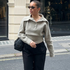 Close-up of knitted polo neckline and soft drape detail