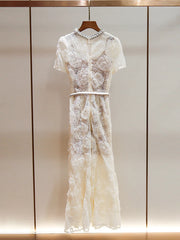 A close-up of the lace and belt detail on the dress.