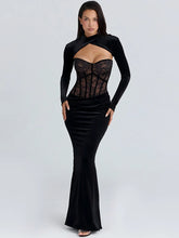 Long sleeve cut-out maxi dress with a structured lace bodice and ruched skirt shown in a clean studio setting.