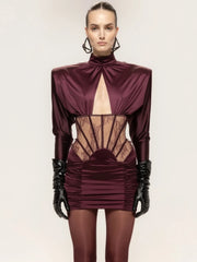 Mini dress featuring a sheer waist and lace corset details in burgundy