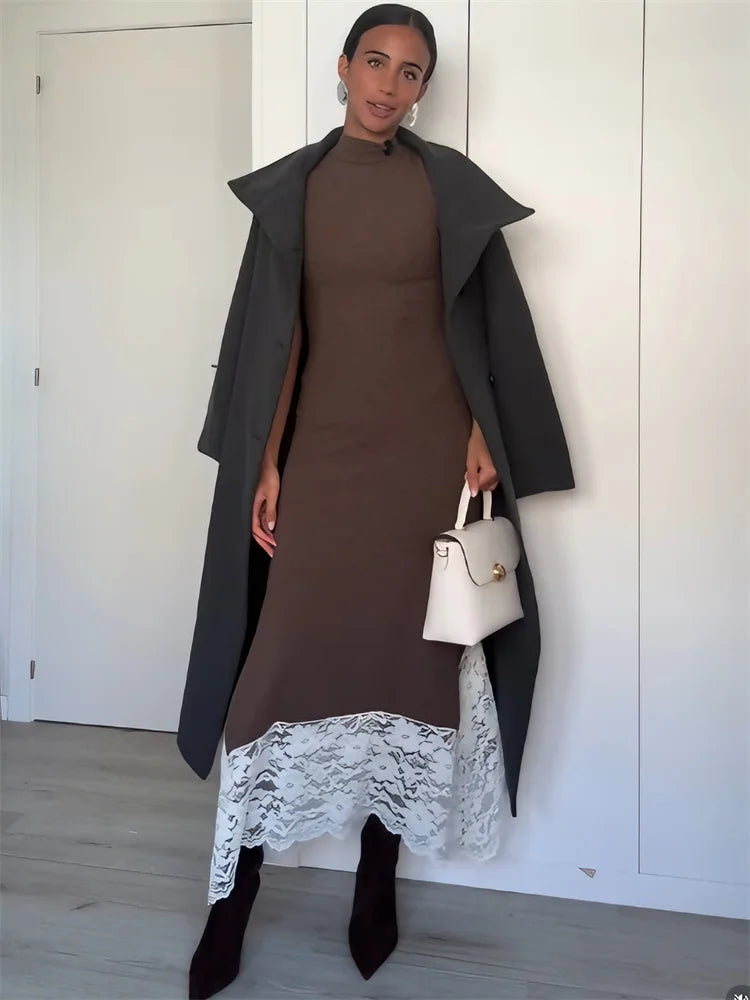 Close view of lace hem detail on an ankle-length maxi dress