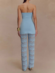 Blue peplum top paired with hollow knit pants for summer fashion