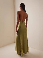Side view of green lace panel maxi dress showing slit detail