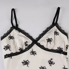 Black lace-retro-inspired lightweight summer dress with feminine details on a white background