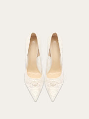 a lace pump with a pointed toe and a thin heel.
