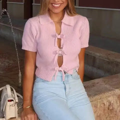 Ribbed cropped tee with bow detail worn on a sunny day