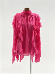 Front-facing silhouette showing lantern sleeves and the blouse’s flowing structure