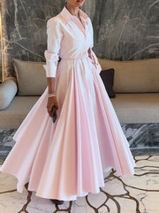 A woman wearing the lapel shirt and long skirt set, styled for a casual outing.