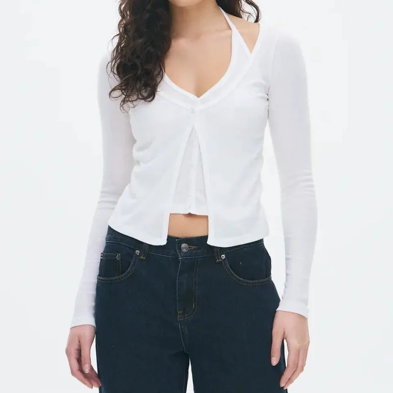 Close-up of the V-neckline showing the halter-style inner layer and soft knit texture.