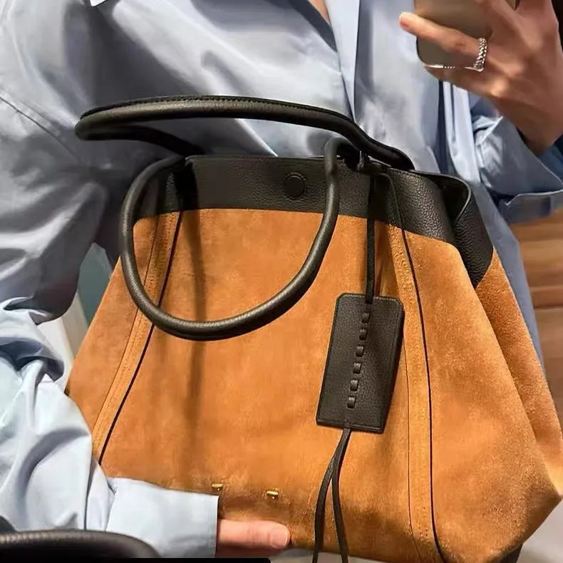 Leather-spliced cotton tote bag styled for everyday wear