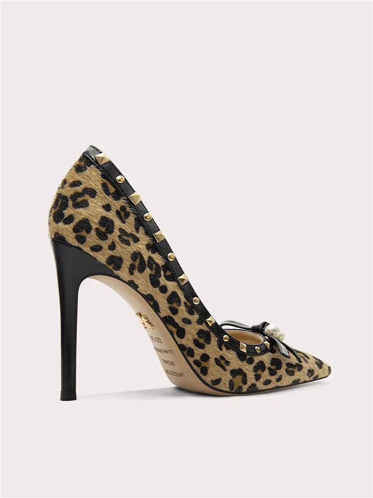 Pair of pointed-toe leopard pattern heels with slim high heel silhouette