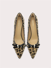 Leopard print pointed-toe pumps with pearl bow detail on the front