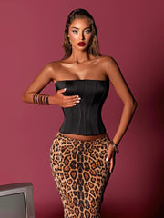 Full-length view of leopard sequin skirt styled with black strapless bustier