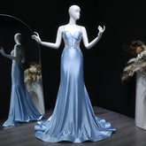 Close-up of appliqué and sequin detailing on the bodice of the gown