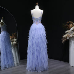 Floor-length formal gown with ruffle skirt and high slit detail