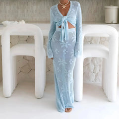 Light blue knit two-piece beach set with long sleeve knotted top and maxi skirt