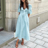 Light blue linen midi dress with lace-up bodice for chic autumn and vacations