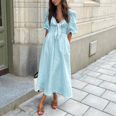 Light blue linen midi dress with lace-up bodice for chic autumn and vacations