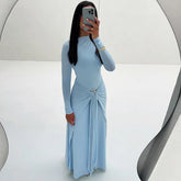 Light blue ruched slit maxi dress styled before a mirror