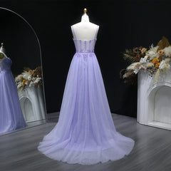 Back view of tulle A-line prom gown with a sweep train