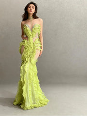 Front view of a lime green corset-style maxi gown featuring layered ruffles and sparkling crystal embellishments along the structured silhouette.
