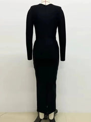 Structured black dress with shimmering decorative accents