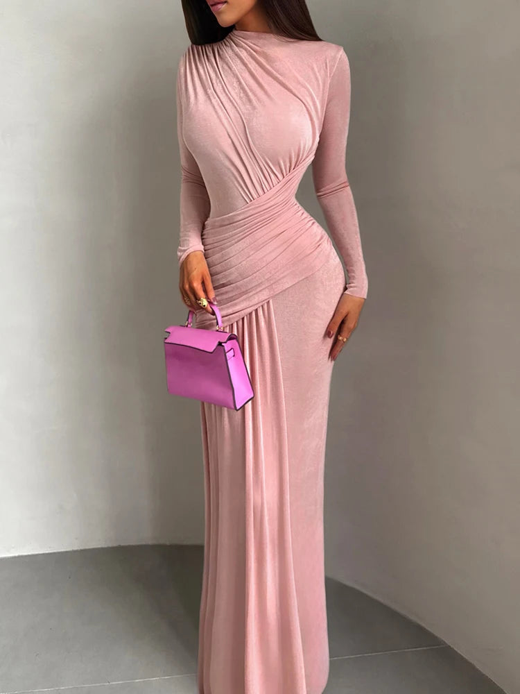 long sleeve blush pink maxi gown styled for formal occasions