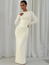 Long sleeve bodycon maxi dress shown from the front, highlighting the clean O-neckline and elongated, sculpted silhouette.