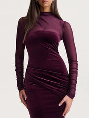 Velvet evening dress with slim silhouette and subtle drape at the waist