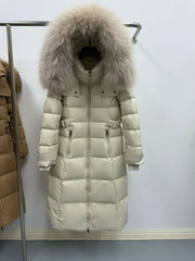 Full-length puffer coat highlighting its relaxed silhouette and evenly quilted construction