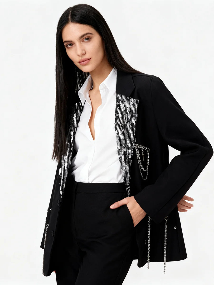 Women’s embellished black blazer styled with casual layering