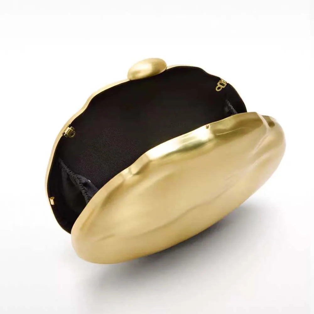 Luxury gift sculptural clutch in luminous round silhouette