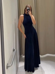 Close-up of halter neckline and velvet texture on maxi dress