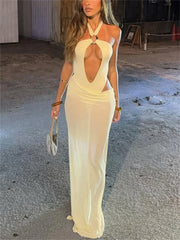 Mesh cutout skirt set with halter top worn for a beach party look