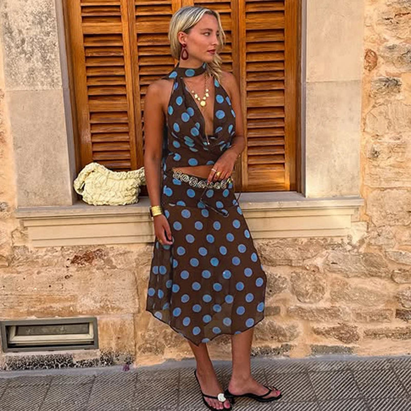 A full-length shot of a mesh V-neck tank and skirt set, styled for a casual day out.